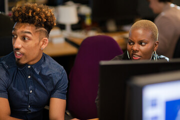 Fototapeta premium Two colleagues working together at computer