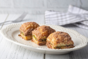 Traditional turkish new dessert cold milky baklava with pistachio (Turkish name; soguk baklava)
