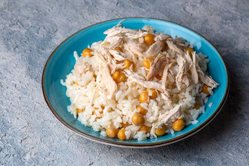 Traditional delicious Turkish food; Rice with chickpeas and chicken (Turkish name; Tavuklu nohutlu pilav or pilaf)