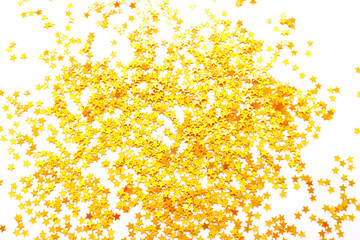 Background of shiny golden little stars, christmas concept. Glitter texture.