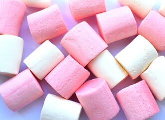 Multi-colored marshmallows. Top view. Background or texture of colorful blue and pink marshmallows.