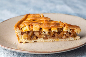 Homemade Apple Pies on a white wooden background, top view. The classic fall Thanksgiving dessert - organic apple pie.