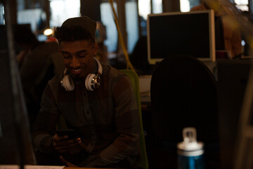 Young man working at computer in office