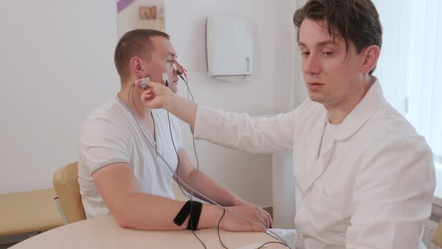 Patient nerves testing using electromyography at medical center
