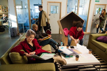 Man and woman reviewing paperwork in cosy office