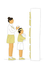 Woman and young boy standing near grocery shelf