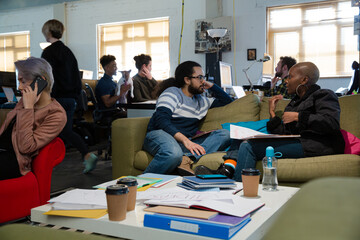 Friends working together in cosy office