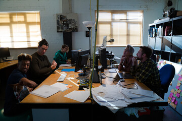Colleagues working in open plan office