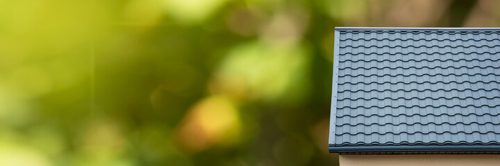 Cozy house with beautiful landscaping. New modern home on green nature background. Realt panorama banner.