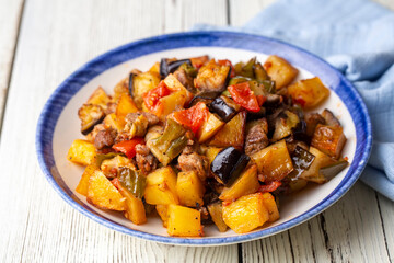 Turkish Kebab eggplant, potatoes, pepper and piece of meat. Vegetables kebab. Turkish cuisine tops view - Turkish name; Sebzeli Koz Kebab or sebze kebabi