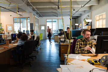 People working in open plan office