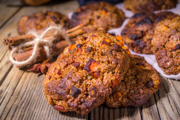 Fall snickerdoodle style pumpkin oatmeal cookies, halloween thanksgiving, autumn baking food, cozy baking wooden background copy space