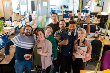 Team posing in office, smiling