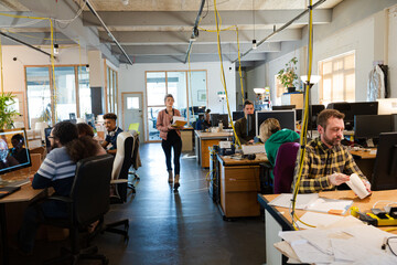 People working in open plan office