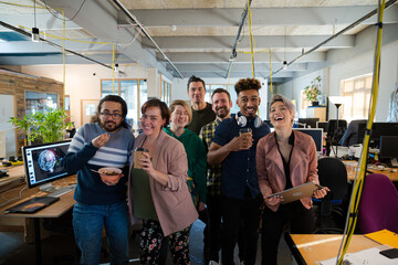 Team posing in office, smiling