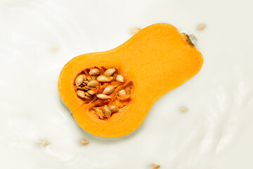 poster of a pumpkin in pumpkin milk with seeds floating around. Vegetarian Milk