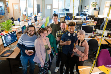 Team posing in office, smiling