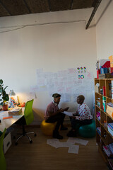Man and woman discussing work in cosy office