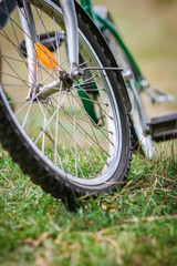 A Concept bike wheel on the grass in the park travel