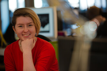 Smiling woman posing in office