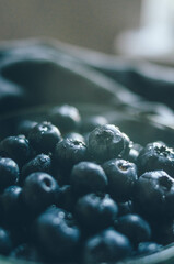 Water drops on fresh ripe sweet blueberry. Macro of dark berries