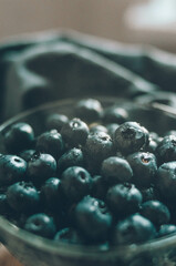 Water drops on fresh ripe sweet blueberry. Macro of dark berries