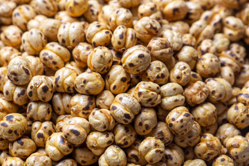 Roasted, yellow chickpeas in bowl (Turkish name; sari leblebi)