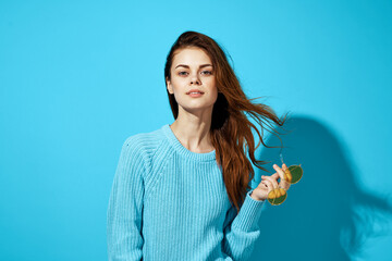 pretty woman in a blue sweater blue background Lifestyle