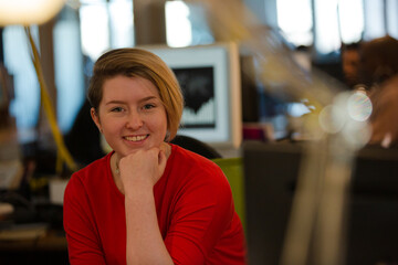 Smiling woman posing in office
