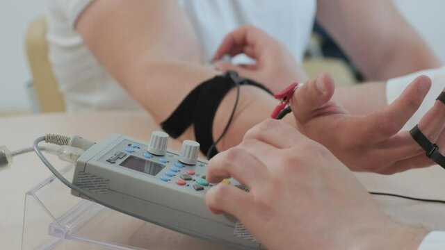 Patient nerves testing using electromyography at medical center