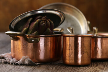 Still life copper utensils on the wooden background