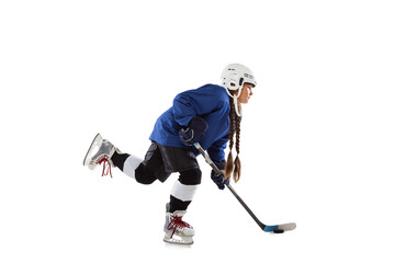 Full-length portrait of child girl, hockey player isolated over black background