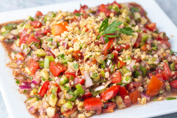 Traditional delicious Turkish cuisine, salad with tomatoes, cucumbers (Turkish name; Gavurdagi salata)