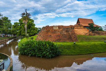 Fototapeta na wymiar City Moat and Street at Chiang Mai old town city and street ancient wall at moat (Hua Lin Corner) is a major tourist attraction in Chiang Mai Northern Thailand.