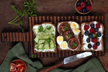 sandwiches with different fillings - vegetables, ham and egg