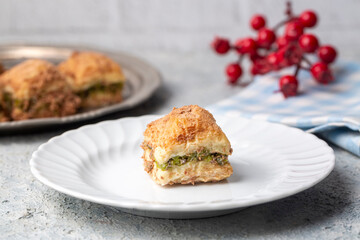 Traditional turkish new dessert cold milky baklava with pistachio (Turkish name; soguk baklava)