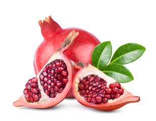 Ripe juicy pomegranate and pomegranate slices with green leaves isolated on white background.
