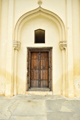 Fototapeta na wymiar Old Islamic Architectural art of Wooden Closed Doors Entrance of Seven Tombs