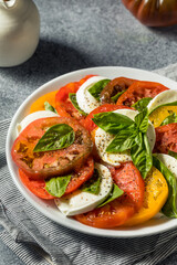 Fototapeta na wymiar Healthy Homemade Heirloom Tomato Caprese Salad