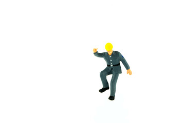 Miniature people engineer worker construction concept on white background