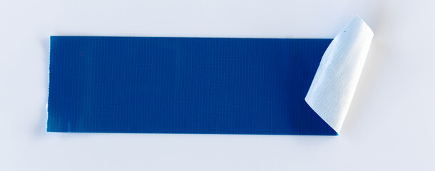 Blue tape on white background. Torn horizontal and different size blue sticky tape, adhesive pieces.