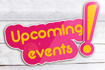 Upcoming events on wooden background 