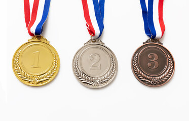 Gold, silver and bronze medals set on white background. Sports athletes winners prize