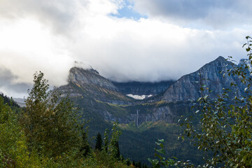 Storm clouds over mountains and valley in Glacier National Park, Montana, USA
