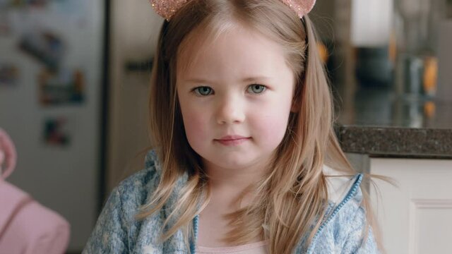 portrait beautiful little girl wearing cute cat ears having fun at home playing dress up enjoying childhood imagination
