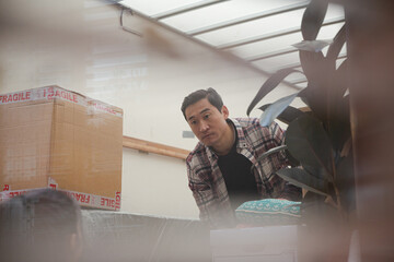 Friends moving, unloading moving van