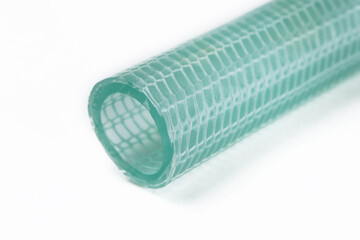 The cut tip of the rubber hose, on a white background