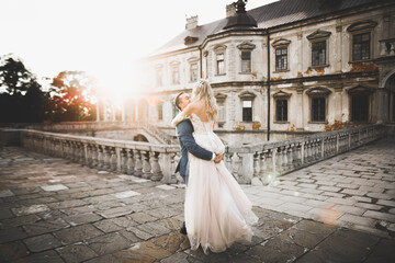 Romantic wedding moment, couple of newlyweds smiling portrait, bride and groom hugging