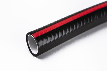 The cut tip of the rubber hose, on a white background