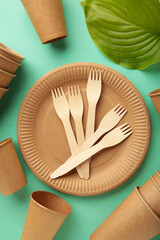 Eco friendly disposable tableware on a mint background